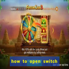 how to open switch oled game card slot